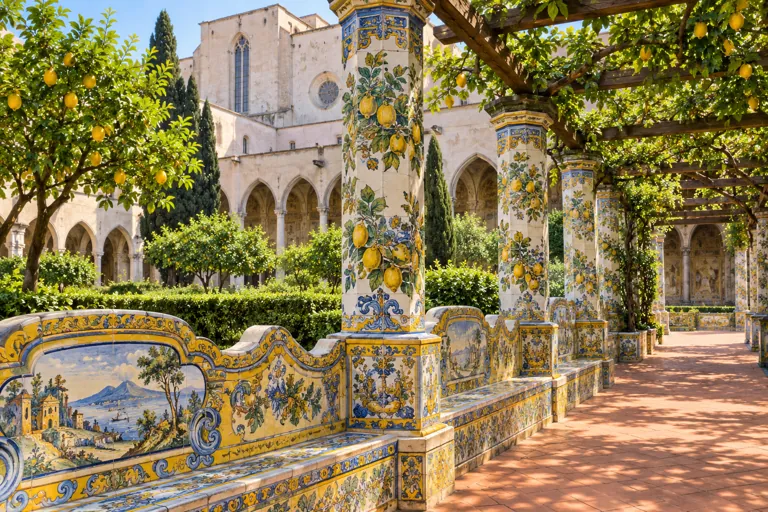 Illustration of a Neapolitan garden cloister with colorful majolica columns and benches